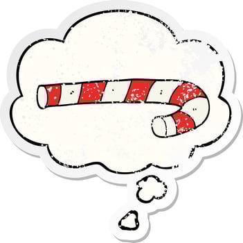 cartoon candy cane and thought bubble as a distressed worn sticker vector