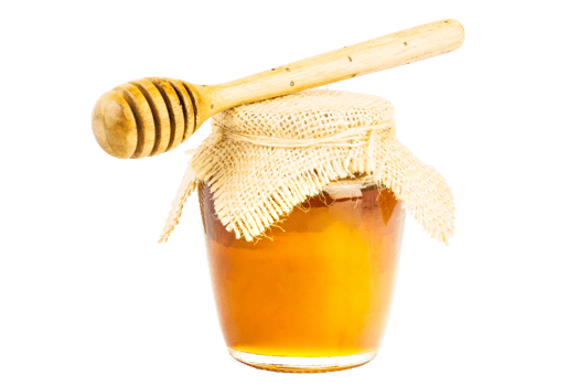 Glass jar full of honey wooden honey dipper on isolated background png