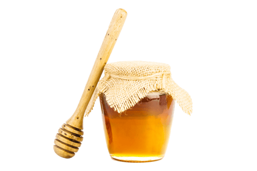 Glass jar full of honey wooden honey dipper on isolated background png