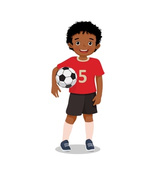 Portrait of cute little African boy in sportswear holding a soccer ball posing with smiling on face vector