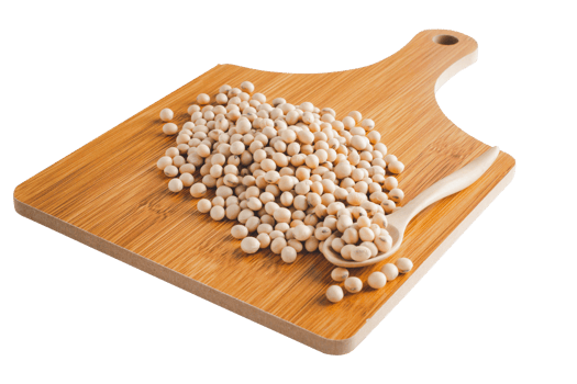 Several soybeans on a wooden cutting board and a spoon on a white background with a clipping path. png