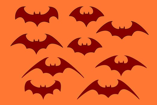 Vector set of different Halloween bats. Halloween flying bats. Vampire vector bat. Dark silhouette of bat flying in a flat style