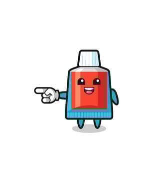 toothpaste cartoon with pointing left gesture vector