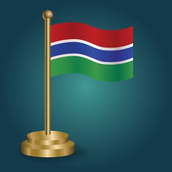 Gambia national flag on golden pole on gradation isolated dark background. table flag, vector illustration