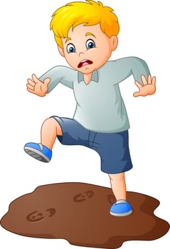Cartoon sad boy with a mud puddle vector