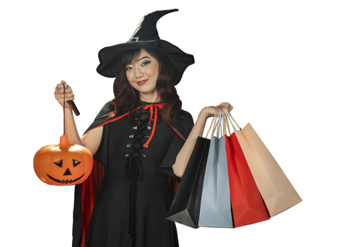 Asian girl in witch costume holding jack o lantern and shopping sale bag for halloween party trick or treat concept isolate on orange background png