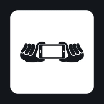 Hands holding a phone as for a selfie icon vector