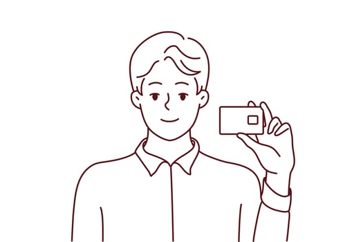 Smiling young man show plastic bank debit or credit card. Happy male client or customer posing with new card issued. Vector illustration.