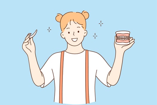 Teeth health and dental services concept. Young little smiling girl cartoon character standing holding invisible aligner orthodontic and braces showing white healthy teeth vector illustration