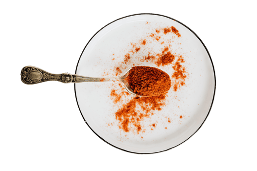 White plate, spoon and orange spice isolated on a transparent background png
