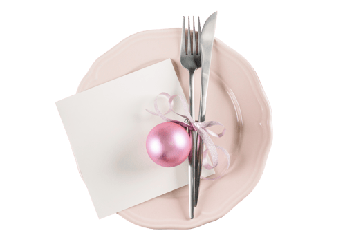 Pink plate, silver cutlery and pink christmas balls isolated on a transparent background png