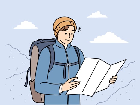 Young man in outerwear hiking in mountains check paper map for directions. Smiling male traveler or backpacker trekking in winter highlands. Vector illustration.