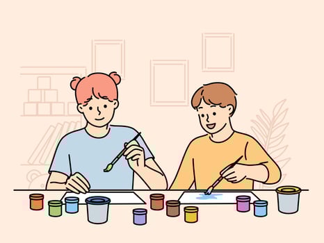 Children sit at table doing joint creativity draw pictures using watercolor or gouache. Boy and girl with brushes in their hands participate in kids creativity competition vector