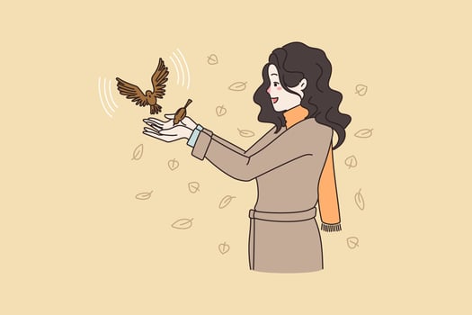 Happy young woman play with birds walk rest outdoor on autumn morning. Smiling millennial girl in coat feed bird auk, enjoy warm days outside on street. Flat vector illustration. Nature lover.