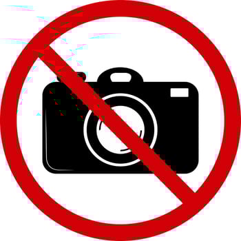No photography sign. Prohibition sign, no photography. Red slashed circle with photo camera silhouette inside. Photo camera is not allowed. Photography ban. Round red stop photographing sign. vector