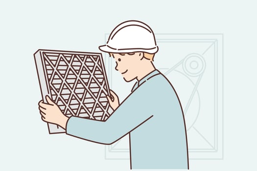 Man holding air conditioner replacement filter doing preventive maintenance or repairing HVAC equipment. Guy in work uniform and helmet changes filter on air conditioner to improve ventilation vector