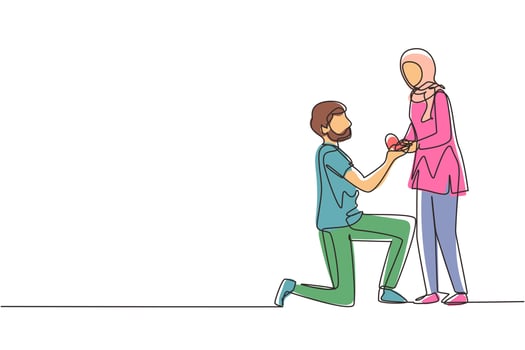 Continuous one line drawing Arabian man kneeling holding engagement ring proposing woman marry him happy marriage wedding. Guy on knees proposing girl to marry. Single line draw design vector graphic