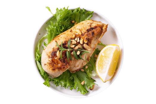 Tasty grilled chicken breast with lemon slice on transparent background png