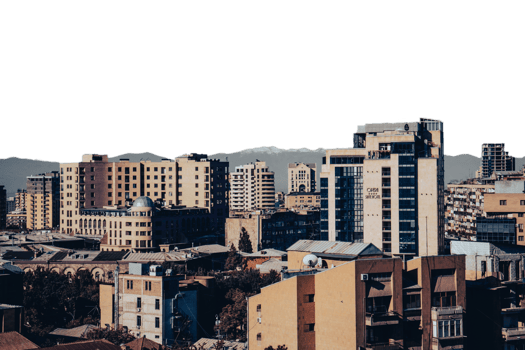 Cityscape in a morning time view in full color concept photo. Beautiful urban scenery with far mountains peak png