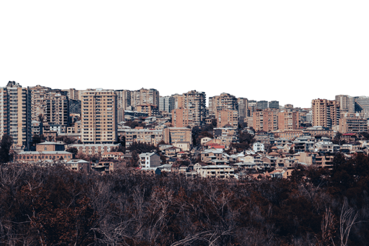 Cityscape in a day time view in full color isolated PNG photo with transparent background.