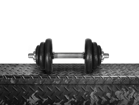 The dumbbell is placed on a metal plate. isolated  PNG transparent