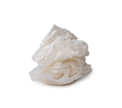 Single screwed or crumpled tissue paper or napkin in strange shape after use in toilet or restroom isolated with clipping path and shadow in png file format.