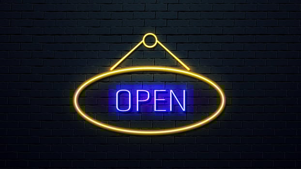 Neon frame with pink and blue cards. A poster for a casino against a dark brick wall. vector