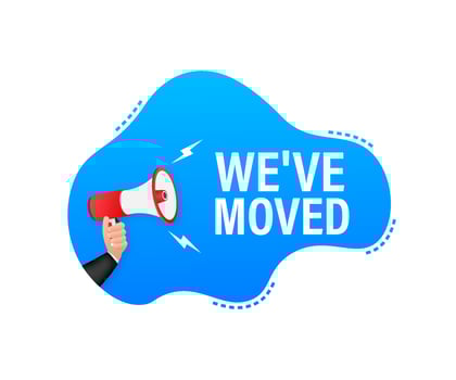 Megaphone label with we have moved. Megaphone banner vector