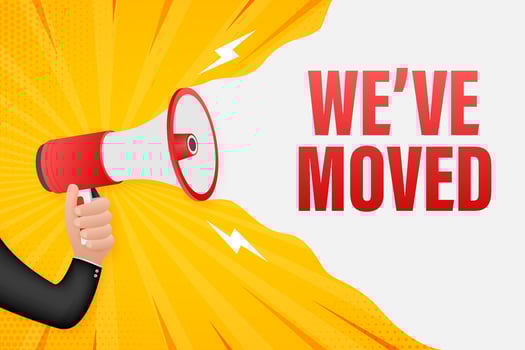 Hand Holding Megaphone with we've moved. Megaphone banner. Web design. Vector stock illustration