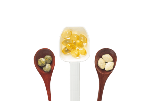 Top view variety of vitamins, minerals, and fish oil in pill form on a wooden spoon isolated on a white or transparent background. Dietary food supplements are a new alternative to health care. png