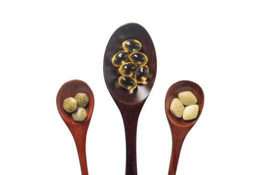 Top view variety of vitamins, minerals, and fish oil in pill form on a wooden spoon isolated on a white or transparent background. Dietary food supplements are a new alternative to health care. png
