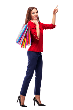 Portrait of young happy smiling pretty woman with shopping bags pointing on something by a finger, isolated png