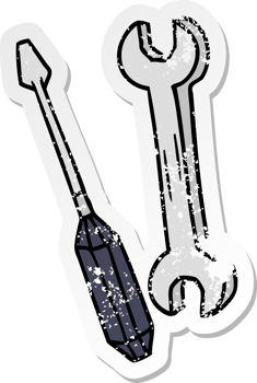 hand drawn distressed sticker cartoon doodle of a spanner and a screwdriver png
