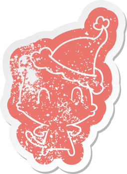 cartoon distressed sticker of a happy cat wearing santa hat png