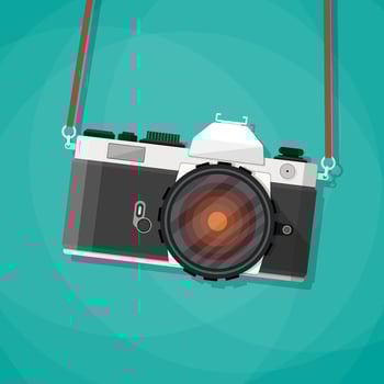 Old vintage photo camera with strap. Hanging retro camera. vector illustration in flat style on green background