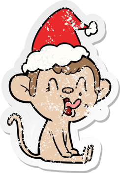 crazy hand drawn distressed sticker cartoon of a monkey sitting wearing santa hat png