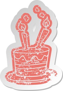 distressed old sticker of a birthday cake png