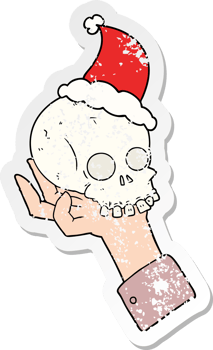 hand drawn distressed sticker cartoon of a hand holding skull wearing santa hat png