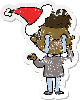 hand drawn distressed sticker cartoon of a man crying wearing santa hat png