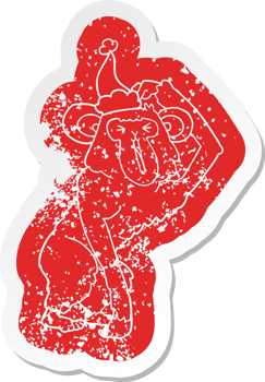 quirky cartoon distressed sticker of a chimp scratching head wearing santa hat png