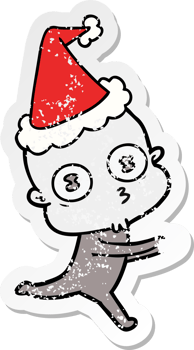 hand drawn distressed sticker cartoon of a weird bald spaceman running wearing santa hat png