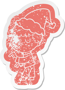 quirky cartoon distressed sticker of a grumpy boy wearing santa hat png