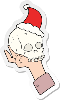 hand drawn sticker cartoon of a hand holding skull wearing santa hat png