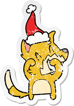 laughing fox hand drawn distressed sticker cartoon of a wearing santa hat png