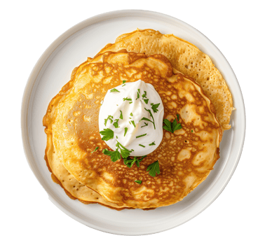 AI generated A plate of chickpea pancake with a dollop of cashew sour cream top view isolated on a transparent background png