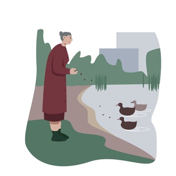Elderly female standing near lake, holding food and feeding birds vector