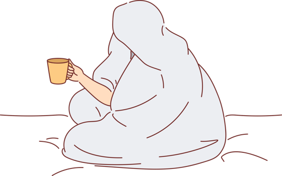 Man drinks coffee sitting on bed and wrapped in blanket to warm up after walk along winter street. Cup of hot coffee in hands of human enjoying comfort and energizing thanks to drink. png