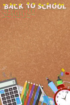 School supplies on cork board with pinned text Back to School. vector