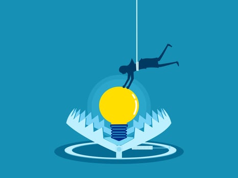 Businessman picks up a light bulb in a trap vector