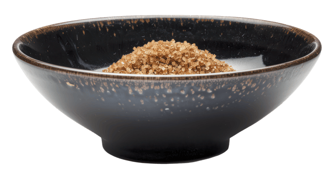 AI generated Organic brown sugar in black bowl on transparent background - stock png. png